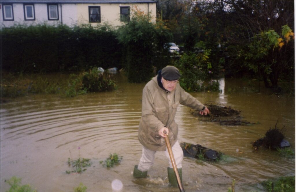1999 Nov Dovenby Flood Robert Wading In His Lime Tree Garden