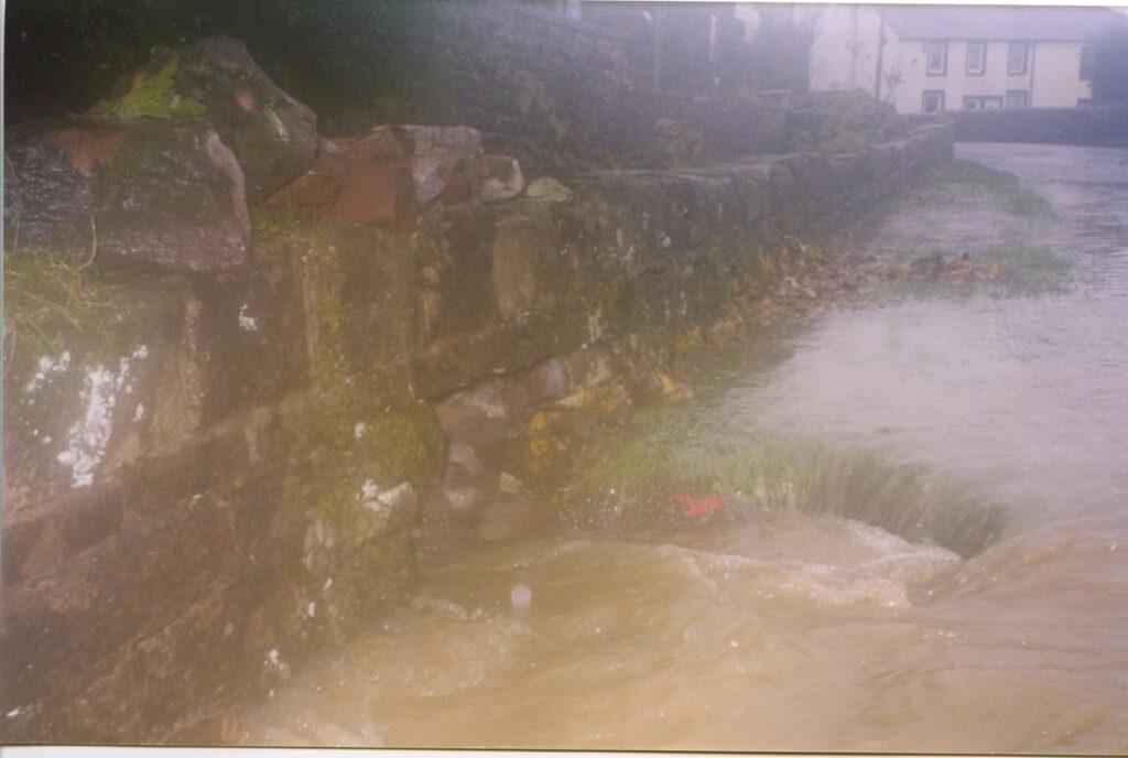 1999 Nov Dovenby Flood Road Drains After We Put Hole In Wall Upstream Of The Bridge By The Drive To Lime Tree House To Stop Lime Tree Being Flooded Success